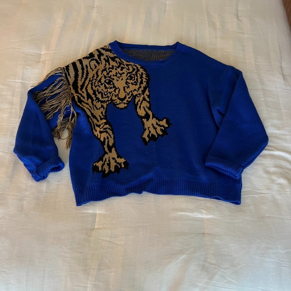 Blue Sweater with string detail on sleeve